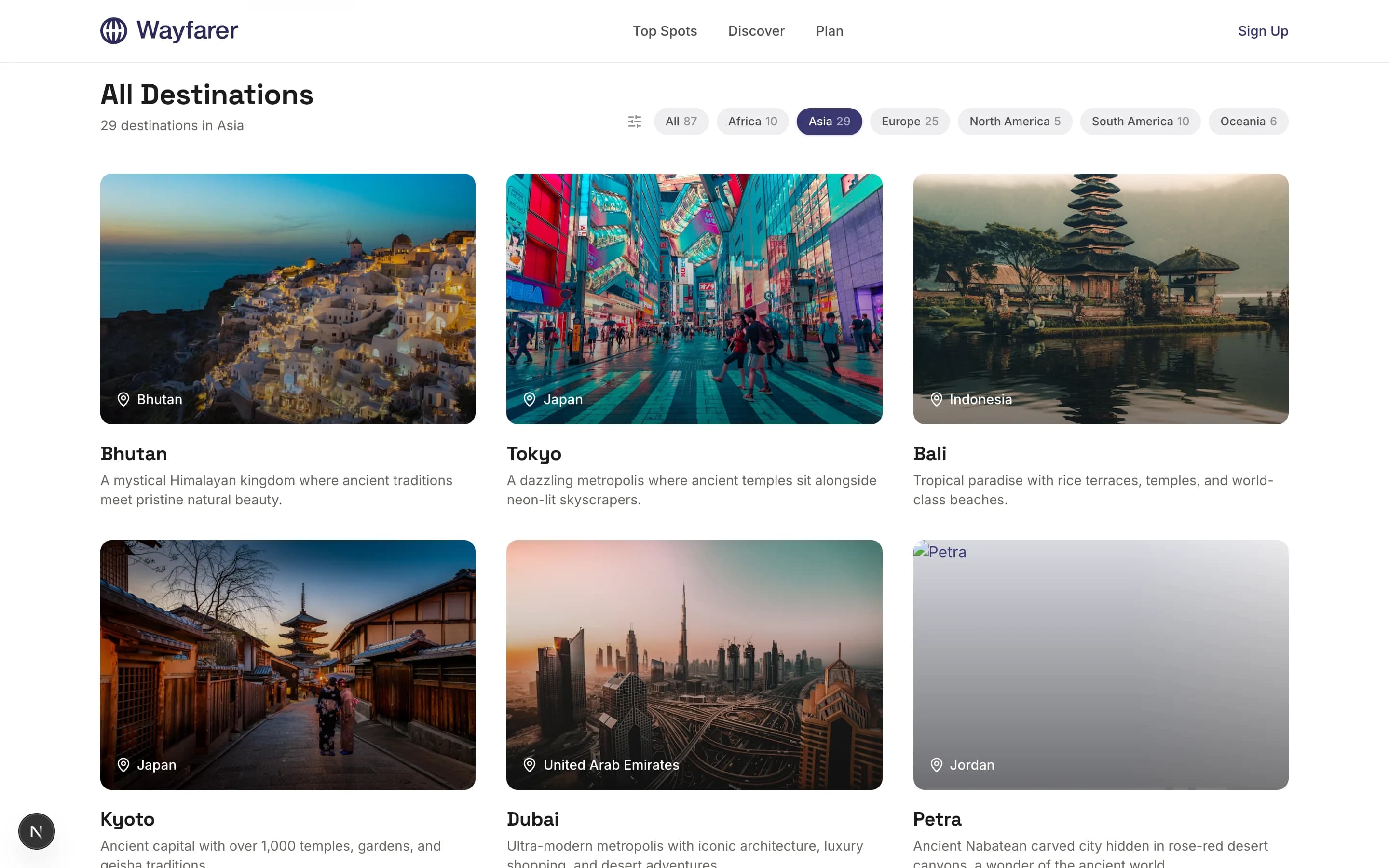 Destinations grid page with continent filter pills at top and a grid of destination cards below